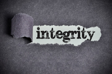 integrity word under torn black sugar paper