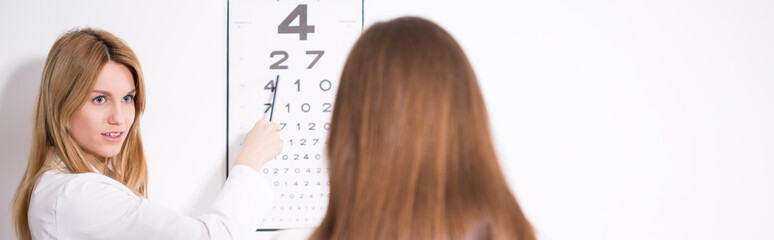 Ophthalmologist diagnosing eye's defect