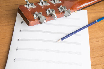 guitar notebook and pencil
