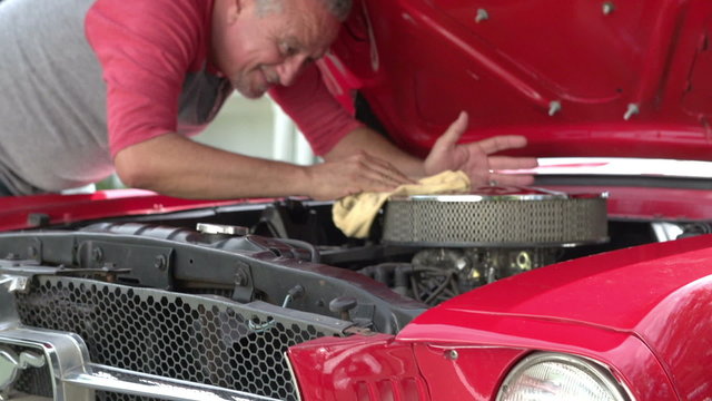 Retired Senior Man Working On Restored Car In Slow Motion