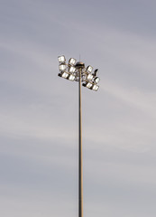 Spotlight on blue sky and cloudy background.