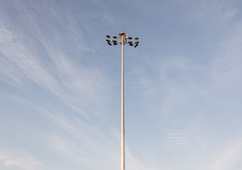 Spotlight on blue sky and cloudy background.