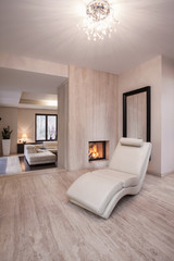 Comfortable settee near to fireplace