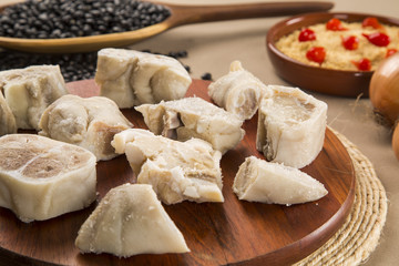 Foot raw pork on wooden background