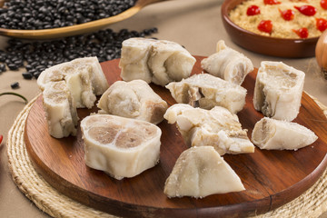 Foot raw pork on wooden background