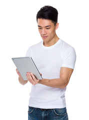 Asian man use of the tablet pc