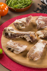 Raw pork rib on wooden background