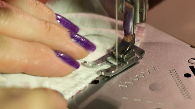 Setting the textile on sewing machine nedle