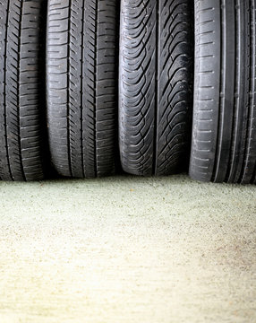 Four car tyres with different treads