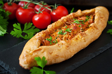 Turkish pide traditional food with beef and vegetables