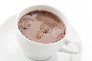a cup of chocolate on white