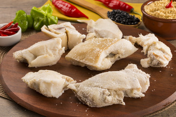 Ear raw pork on wooden background