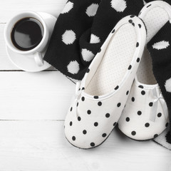 Feminine slippers, knitwear and coffee