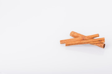 Cinnamon sticks on white background