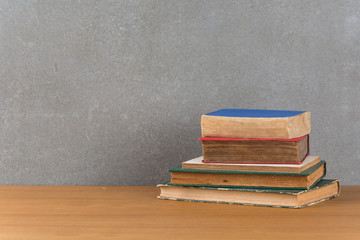 stack of old books on wood table