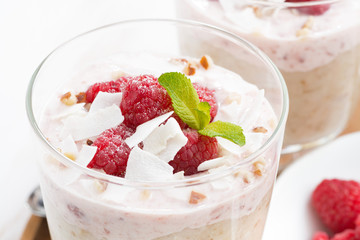 healthy dessert with oatmeal, whipped cream and fresh raspberry