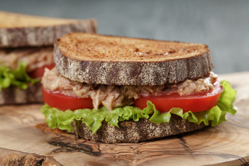 Sandwich with tuna and vegetables on rye bread
