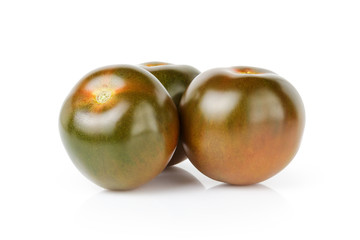 ripe kumato tomatoes isolated on white