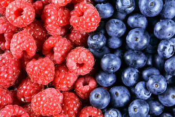 Clouse up Fresh Organic  Blueberries and Raspberries. Rich with vitamins Background, texture
