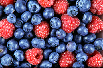 Clouse up Fresh Organic  Blueberries and Raspberries. Rich with vitamins Background, texture