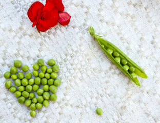 Green peas on the vintage linen background