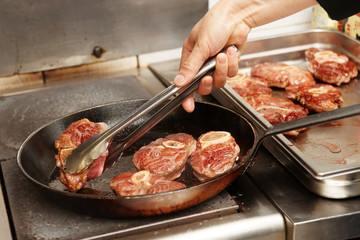 Chef is frying meat