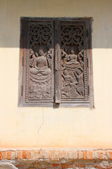 old window at Ing Hang Stupa in Savannakhet