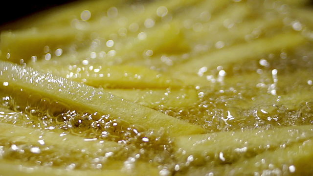 Fried potatoes. Potatoes fried in oil. French fries.