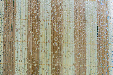 Water drops of wooden background