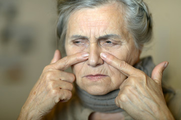 Portrait of a sick elderly woman