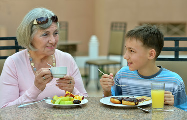 Grandmother with grandson at breakfast