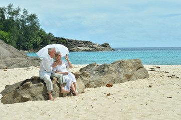 Elderly couple rest at tropical resort