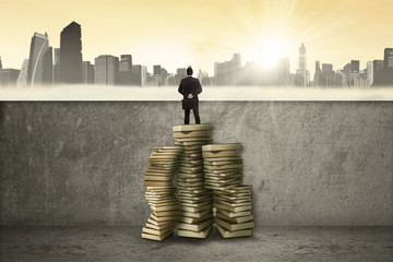 Woman using books to see the city
