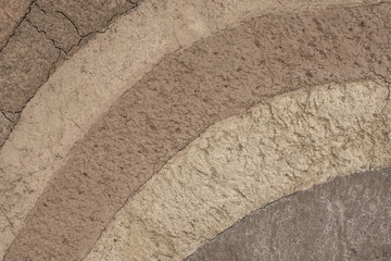 patterned layer of clay soil for the background.