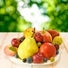 Naklejka na ściany i meble various ripe fruits on a plate