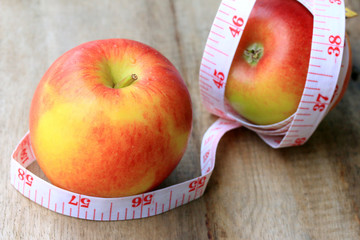 measure tape and apple