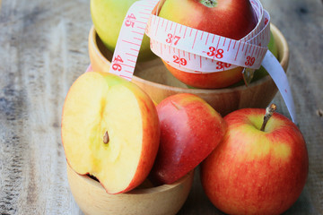 measure tape and apple