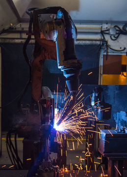 robots welding in a car factory