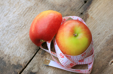 measure tape and apple