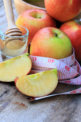 measure tape and apple