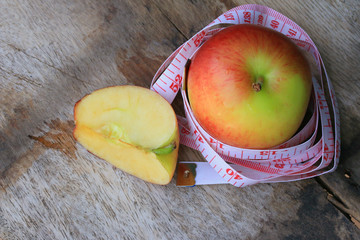 measure tape and apple