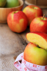 measure tape and apple