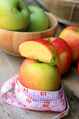 measure tape and apple