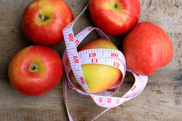 measure tape and apple