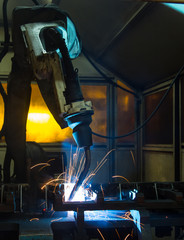 robots welding in a car factory