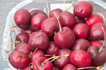 close up of cherry  in a plastic box.