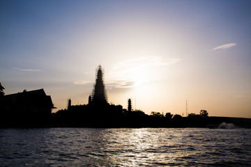 Wat Arun, The Temple of Dawn, at sunset,view across river. Bangk