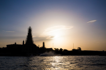 Wat Arun, The Temple of Dawn, at sunset,view across river. Bangk