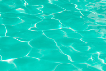 green pool water with sun reflections