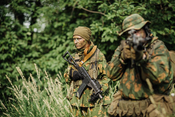 Group of soldiers special forces during the raid in the forest